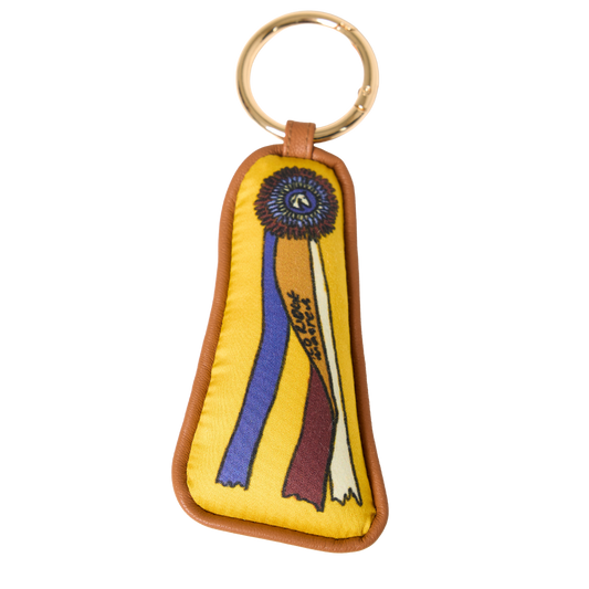 A whimsical silk and leather equestrian bag charm inspired by horse show ribbons — the perfect gift for proud horse girls and riders who love celebrating a winning weekend at the barn.