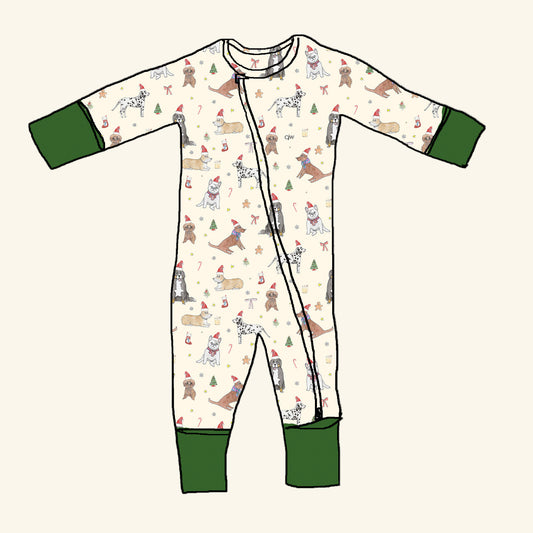 Holiday Pup Print organic cotton kids pajamas by CJW — cream base with spruce green cuffs and hand-illustrated dogs wearing Santa hats and scarves. Sustainable, made-to-order, and perfect for matching family holiday sleepwear.
