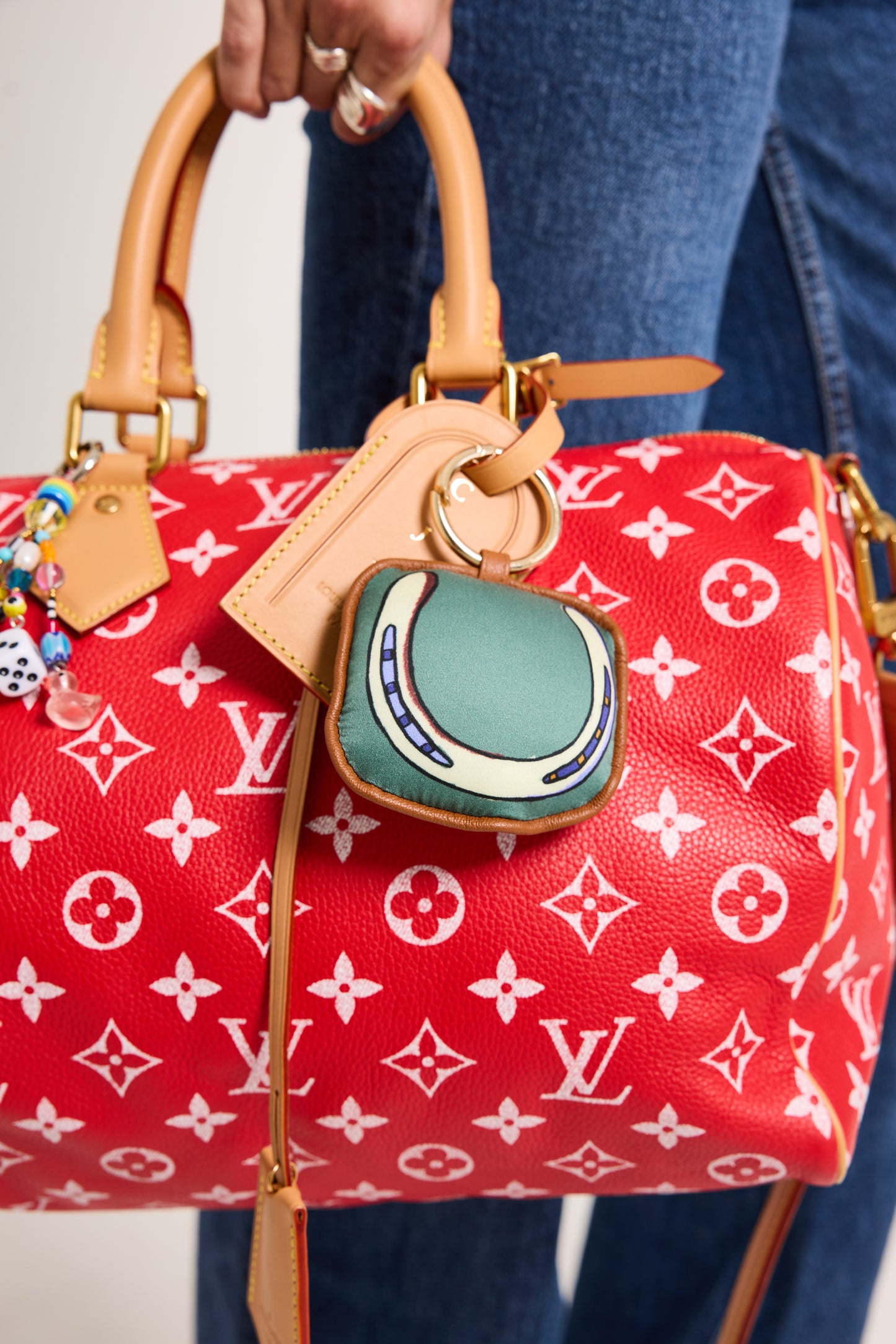A silk and leather lucky horseshoe bag charm designed for equestrians who believe in barn magic — a subtle good-luck charm for show days, stable life, and everyday adventures.