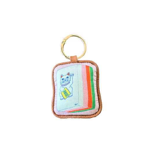 CJW Mahjong Bag Charm — hand-illustrated stuffed silk charm with leather piping and gold ring hardware
