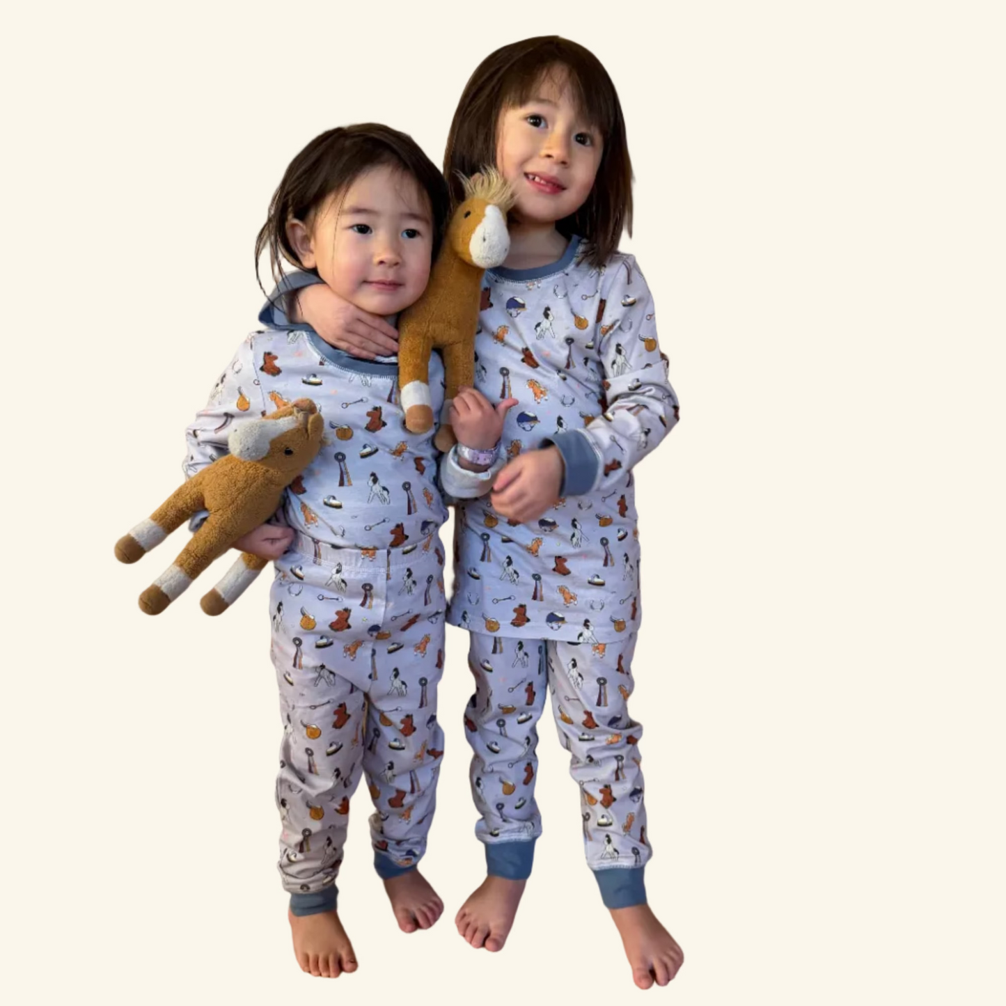 Organic cotton kids pajamas in sizes 2T–10T featuring a hand-illustrated Year of the Horse print. Designed for tiny horse girls.